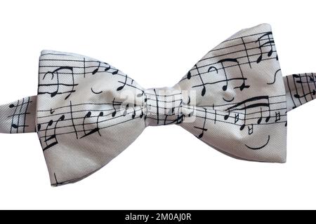 White bow tie with musical notes on set on white background Stock Photo