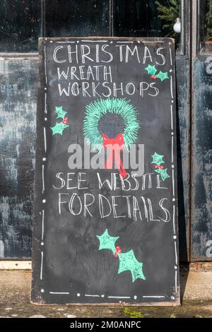 Florists shop business called Forge Flowers advertising christmas wreath workshops for the festive season, Halnaker, West Sussex, England, UK. Stock Photo