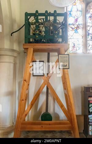 Old clock mechanism inside St Michael's Church in Northchapel village, West Sussex, England, UK. It is over 150 years old. Stock Photo