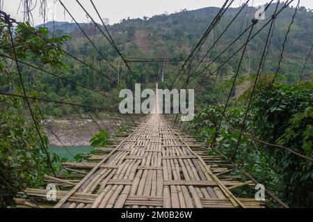 Landscape view of long bamboo hanging bridge crossing the river Siang or Siyom, Arunachal Pradesh, India Stock Photo