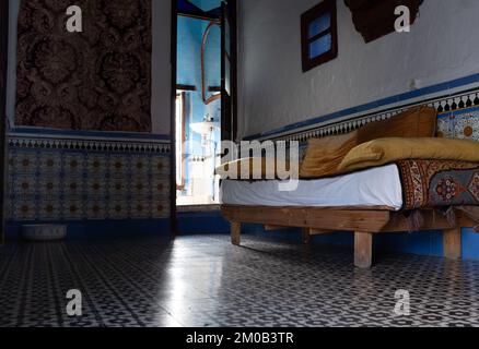 Tetouan, Morocco - April 19, 2019: Sofa bed in a Moroccan hotel room, in the town of Tetuan Stock Photo