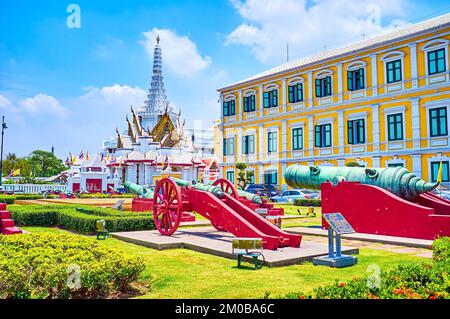 Outdoor Cannon museum at Ministry of Defence building and City Pillar Shrine on background, Bangkok, Thailand Stock Photo