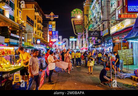 BANGKOK, THAILAND - APRIL 23, 2019: The crowds on Khaosan Road, the night bars offer variety of food, beverages and amusements to passers-by, on April Stock Photo