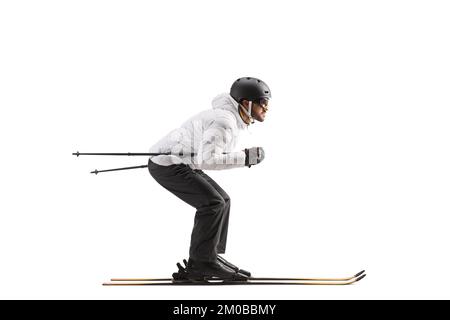 Full length profile shot of a male skier skiing isolated on white background Stock Photo