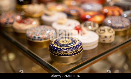 Metal gift boxes decorated with colorful turkish motifs, jewelry box, box with ottoman figures embroidered, blurred background, image with space for t Stock Photo