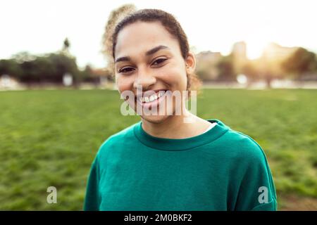 Young hispanic latin woman smiling at camera outdoor Stock Photo