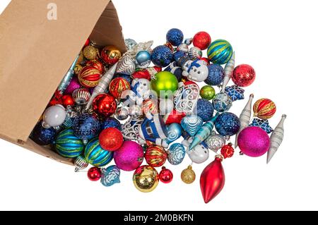 Multi-colored Christmas tree ornaments spilled out on white bckground with copy space Stock Photo