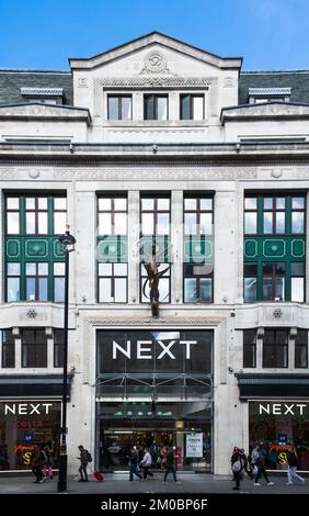 London, England, Sept 2022, pedestrians passing by Next building in Oxford street Stock Photo