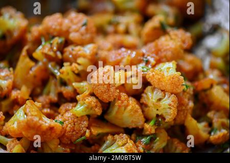 Cauliflower vegetable made with adding indian spices and mirchi powder. Used selective focus. Stock Photo