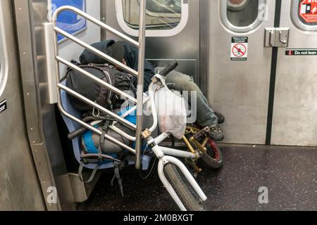 Homeless man asleep on a C line subway train in New York on Friday ...