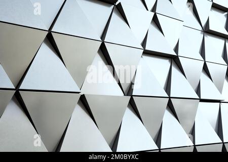 Silver wall facade with geometric shapes triangle elements. Abstract architecture details pattern. Minimal abstract background Stock Photo