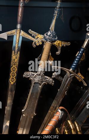 Replicas of swords from Conan the Barbarian and Lord of the Rings movies. Stock Photo