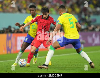 Brazil's Vinicius Junior, South Korea's Hong Chul and Brazil's Casemiro (left-right) in action during the FIFA World Cup Round of Sixteen match at Stadium 974 in Doha, Qatar. Picture date: Monday December 5, 2022. Stock Photo