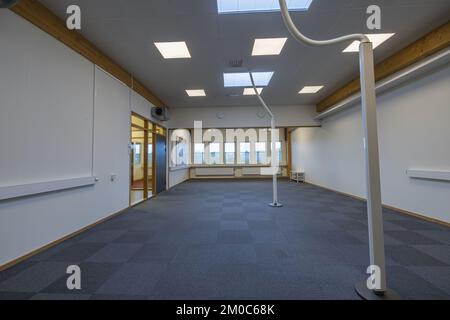 View of big modern empty office space with white walls. Rental office. Sweden. Stock Photo