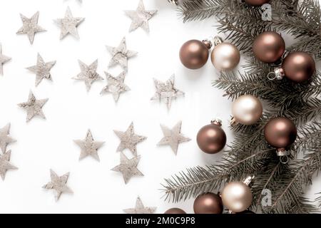 Christmas decorations with golden stars on a white background. Greetings card. Flat lay. Copy space. Stock Photo