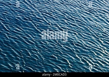 Light blue gradient color abstract background of wavy sea surface Stock Photo