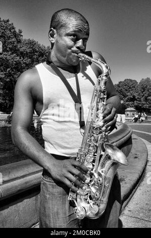 A saxophonist busking in Central Park's Bethesda Terrace, Manhattan, New York, USA. Central Park. Street musicians. You can hear jazz in many corners Stock Photo