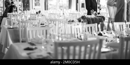 Tables ready to welcome wedding guests Stock Photo