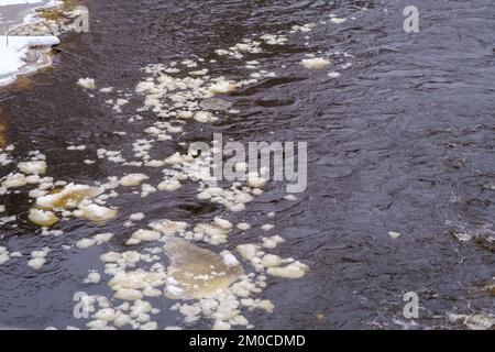 Ice floes float on the river. Seasonal ice drift Stock Photo