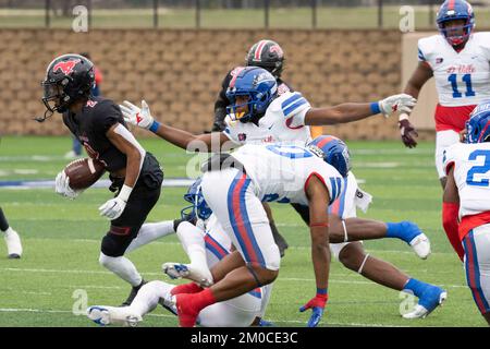 Georgetown Texas USA, December 3 2022: Receiver gains yards after catching a pass during a University Scholastic League (UIL) quarter-final playoff football game in central Texas. ©Bob Daemmrich Stock Photo