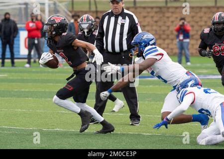 Georgetown Texas USA, December 3 2022: Receiver gains yards after catching a pass during a University Scholastic League (UIL) quarter-final playoff football game in central Texas. ©Bob Daemmrich Stock Photo