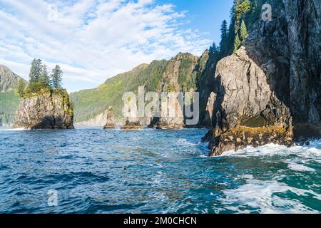 Mountains and sea stacks along the rugged coastline of Resurrection Bay near Seward, Alaska Stock Photo