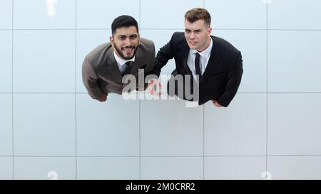 Portrait of two concentrated businessmen partners dressed in formal suit Stock Photo