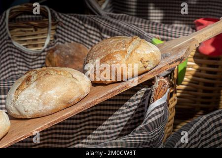 closeup in horizontal view of freshly baked loaves of bread made in an artisan way Stock Photo