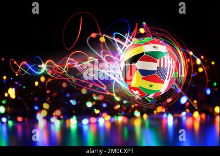 Glowing football soccerball with team national flags of qatar 2022 Stock Photo
