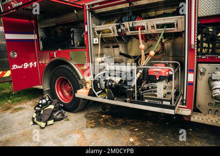 The side view of equipment packed neatly inside a fire engine, fire ...