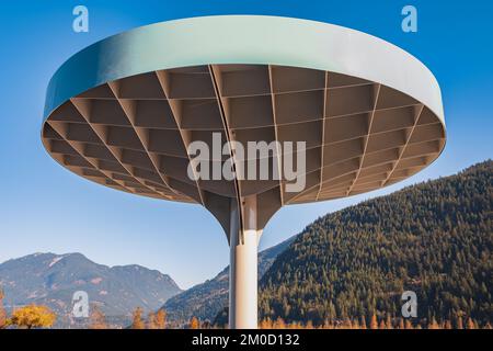 Metal modular building in the form of a dome. The tent stands on the sand in the center of the park. View from below of the steel dome. Nobody, travel Stock Photo