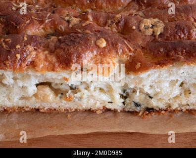 Freshly baked buttery, garlic-flecked bread, close up. Soft crumb of parmesan garlic bread Stock Photo