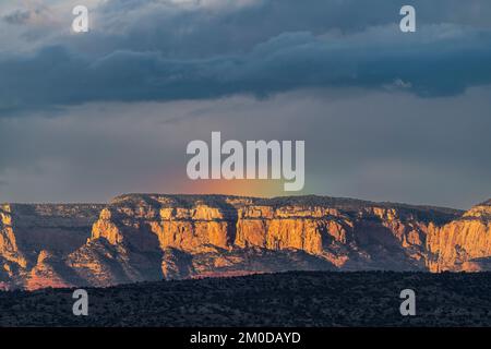 Storm clouds and rainbow over Red Rock Wilderness Area, AZ, USA, Early October, by Dominique Braud/Dembinsky Photo Assoc Stock Photo