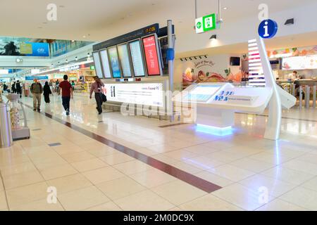 DUBAI, UAE - MARCH 31: flight schedule in airport on March 31, 2014 in Dubai. Dubai International Airport is an international airport serving Dubai. I Stock Photo