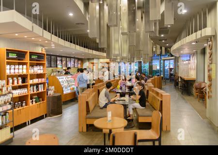 SHENZHEN, CHINA-APRIL 13: Starbucks Cafe interior on April 13, 2014 in Shenzhen, China. Starbucks Corporation is an American global coffee company and Stock Photo
