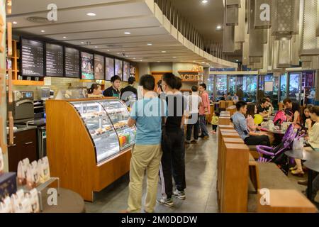 SHENZHEN, CHINA-APRIL 13: Starbucks Cafe interior on April 13, 2014 in Shenzhen, China. Starbucks Corporation is an American global coffee company and Stock Photo