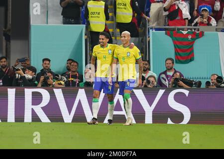 DOHA, QATAR - DECEMBER 5: Player of Brazil Richarlison celebrates with Marquinhos after scoring a goal during the FIFA World Cup Qatar 2022 Round of 16 match between Brazil and South Korea at Stadium 974 on December 5, 2022 in Doha, Qatar. (Photo by Florencia Tan Jun/PxImages) Stock Photo