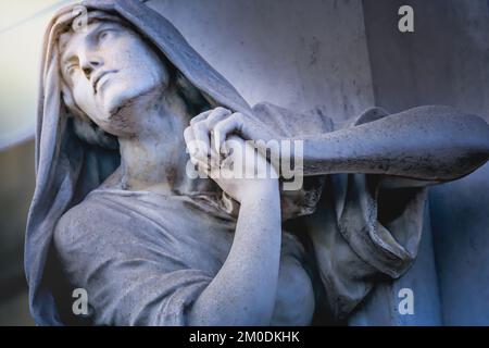 Faithfull Virgin Mary with praying hands and blessing, looking at the sky Stock Photo