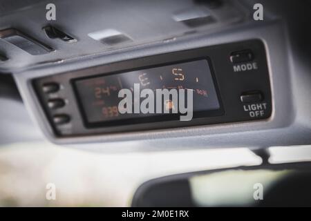 Old navigation system with compass in SUV car Stock Photo