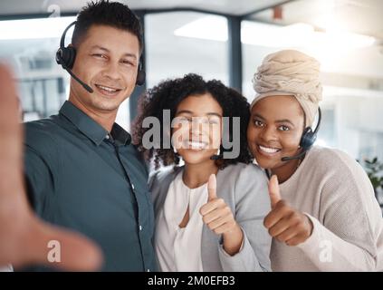 A group of customer service agents showing diversity in a call center ...