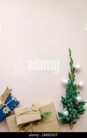 Christmas background with hand crafted gifts, presents on rustic  table. Christmas or New year DIY packing. Holiday decor concept. Overhead, flat lay Stock Photo