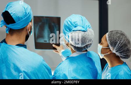 Medical, x ray and surgery with doctors planning in meeting for mri scan, strategy or research. Medicine, consulting and radiology image with Stock Photo