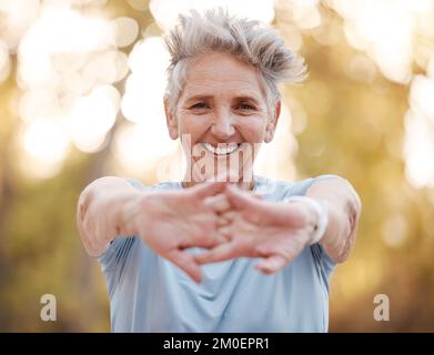 Portrait, senior woman and stretching hands, outdoor and exercise for retirement, health and fitness. Elderly female, mature lady and workout for Stock Photo