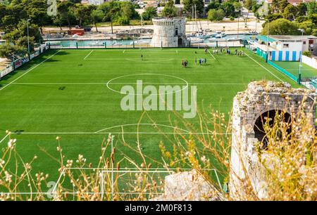 An aerial view of a green soccer field in Trogir town, Croatia Stock Photo