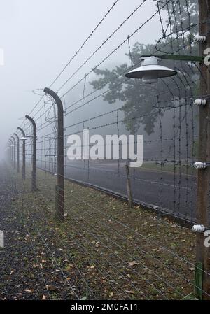 reconstructed camp fence in the fog in the Buchenwald concentration camp, today a concentration camp memorial, Germany, Thueringen, Weimar Stock Photo