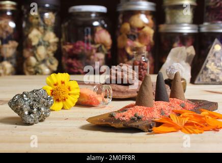 Incense Cones on Stone Slab With Chakra Crystals and Flowers Stock Photo