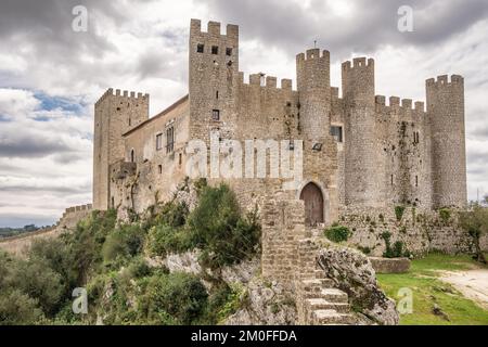 Castle of Obidos, a medieval fortified village at cloudy day in Portugal Stock Photo