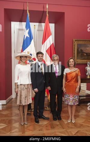 Danish Crown Prince Frederick poses with Chilean Foreign Affairs minister Alfredo Moreno, after being decorated with the Chancellery of Chile's medal of merit, at La Moneda Palace in Santiago, Chile, 11 March 2013. Stock Photo