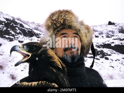 Kazakstan 2002. The last eagle hunters in the world. In Kazakstan a man is a man when he can ride a horse and hunt with an eagle. They have done it the same way for the last 4000 years. Stock Photo