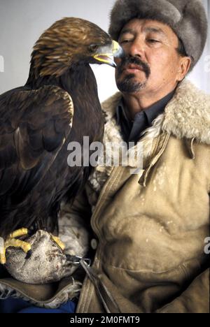 Kazakstan 2002. The last eagle hunters in the world. In Kazakstan a man is a man when he can ride a horse and hunt with an eagle. They have done it the same way for the last 4000 years. Stock Photo